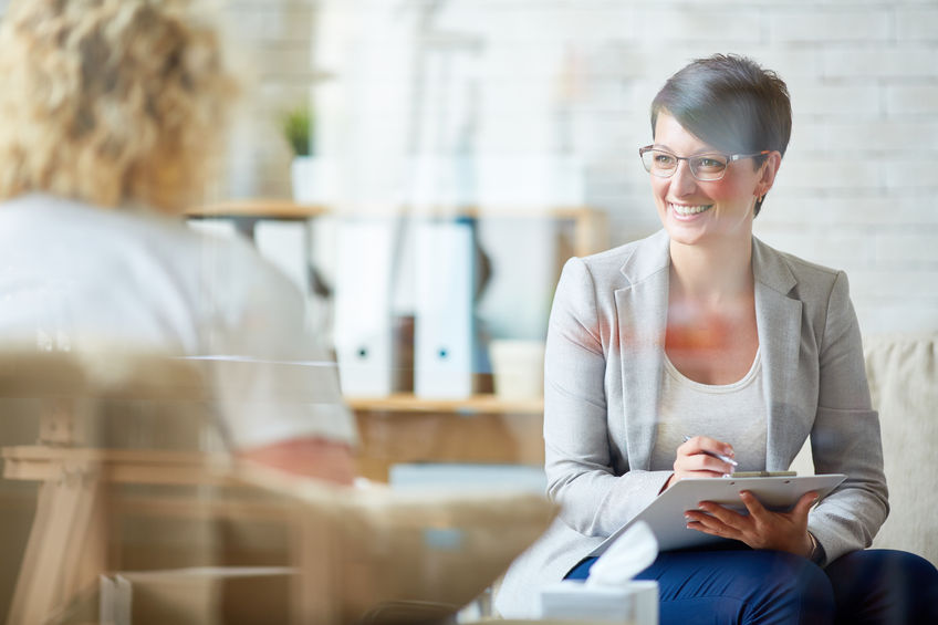 61356403 - happy psychologist listening to her patient problem